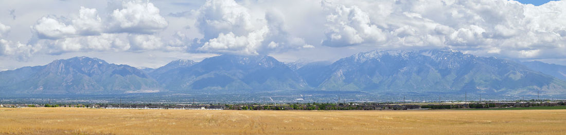 Panoramic view of snowcapped mountains against sky