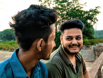 Portrait of young couple outdoors