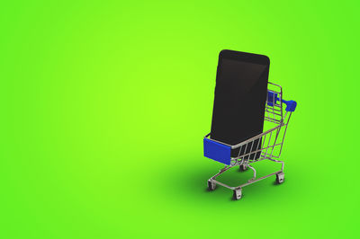 Close-up of computer keyboard against yellow background