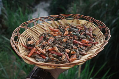 A basket of dried chilli with out of focus background