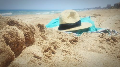 Panoramic shot of shoes on beach against sea