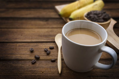 Close-up of coffee cup on table