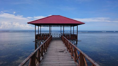 Gazebo over sea against sky