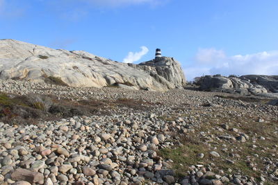 Rocks on land against sky