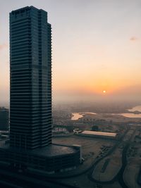 Aerial view of cityscape at sunset