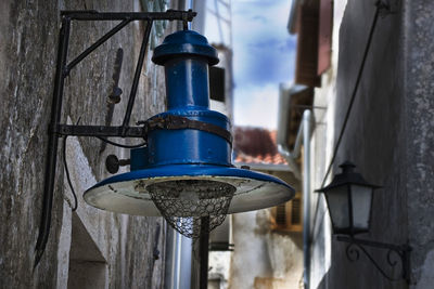 Close-up of metal structure against sky