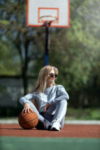 Young woman playing basketball