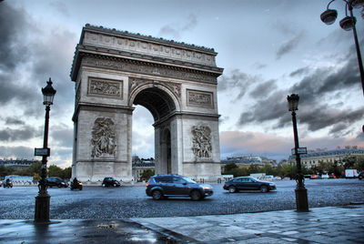 Triumphal arch against sky during sunset