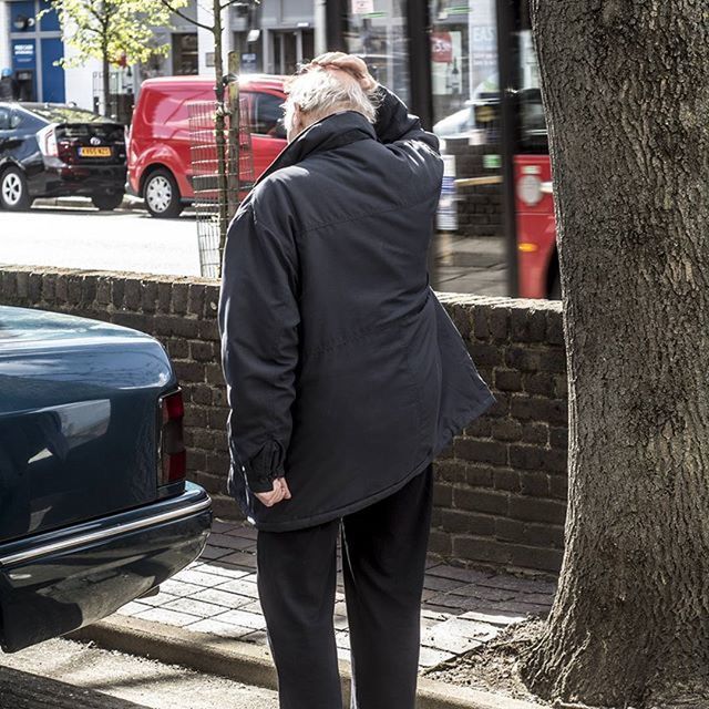 rear view, men, casual clothing, building exterior, street, lifestyles, car, city, transportation, land vehicle, mode of transport, built structure, full length, standing, architecture, city life, jacket, three quarter length