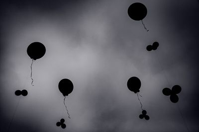 Low angle view of hot air balloons against sky