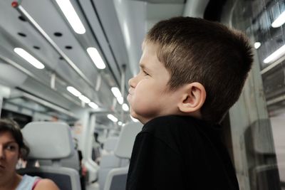 Close-up of boy in bus
