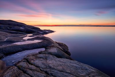 Scenic view of sea against sky at sunset