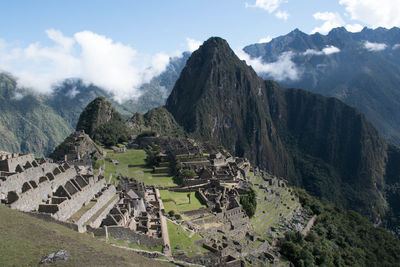 Scenic view of mountains against cloudy sky