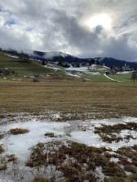 Scenic view of landscape against sky during winter