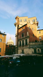 Buildings in city against sky