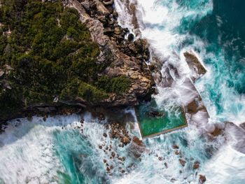 Aerial view of coastline by sea