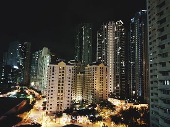 View of skyscrapers lit up at night