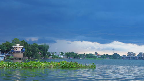 Buildings against cloudy sky