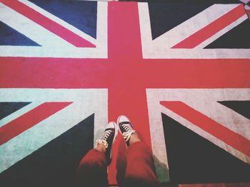 Low section of woman over british flag