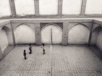 Rear view of people walking outdoors