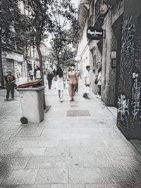 People walking in front of building