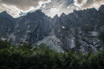Panoramic view of trees and mountains against sky