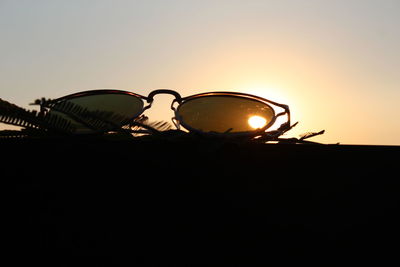 Close-up of silhouette against clear sky