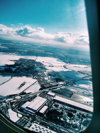 High angle view of cityscape seen through airplane window