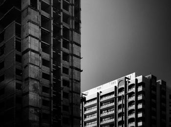 Low angle view of office building against sky