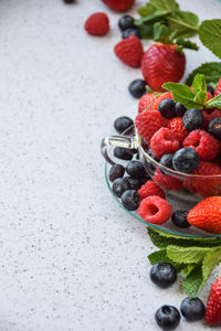 Close-up of berries in tea cup