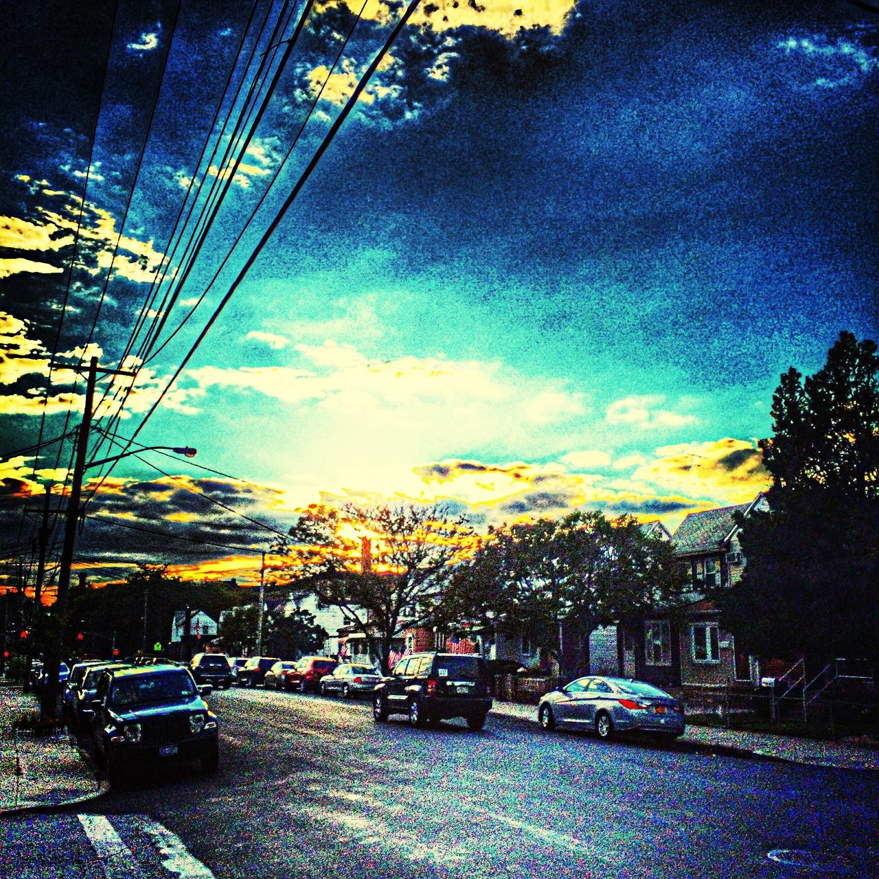 car, tree, sky, transportation, sunset, land vehicle, street, road, cloud - sky, mode of transport, building exterior, season, city, street light, nature, scenics, beauty in nature, outdoors, no people, built structure