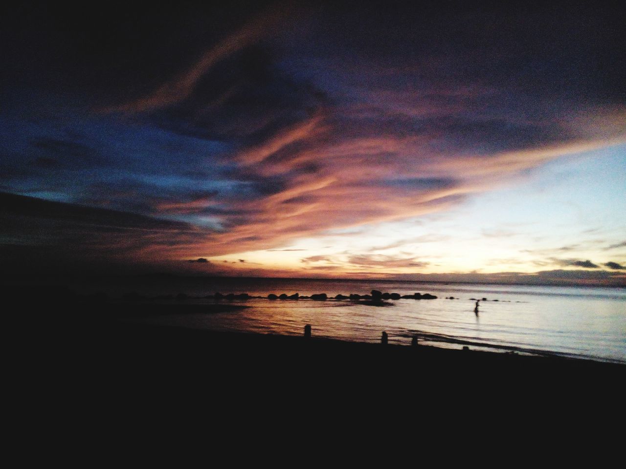 sea, water, horizon over water, scenics, sunset, sky, beach, tranquil scene, beauty in nature, tranquility, shore, cloud - sky, silhouette, nature, idyllic, cloud, dusk, orange color, incidental people, outdoors