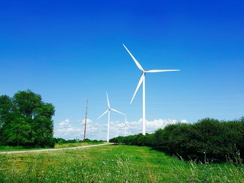 Wind turbines on field