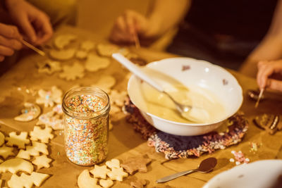 High angle view of hand preparing food on table