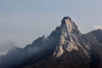 Panoramic view of volcanic mountain range against sky