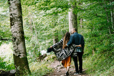 Rear view of a man on woman in forest