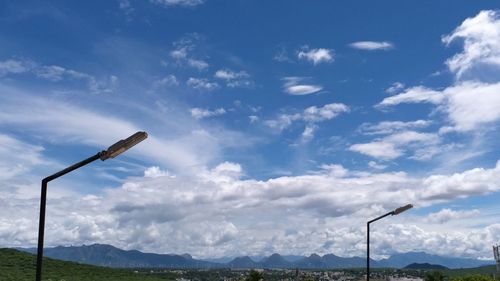 Low angle view of street light against sky