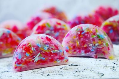 Close-up of multi colored candies on table