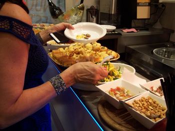 Midsection of woman having food