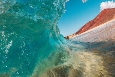 Scenic view of sea against blue sky