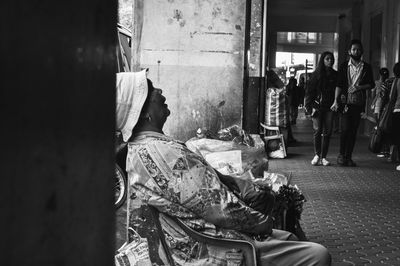 People standing by wall in city