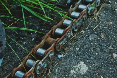 High angle view of rusty chain on land