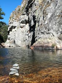 Scenic view of river by rock formation