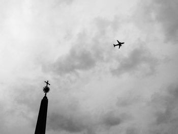 Low angle view of airplane flying in sky