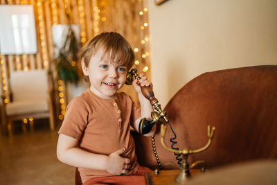 Little boy with antique phone. high quality photo