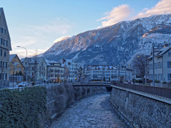 View of residential buildings against cloudy sky