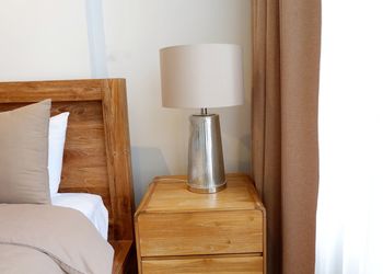 Close-up of electric lamp on table at home