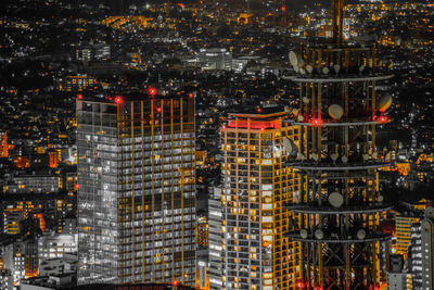 Illuminated buildings in city at night