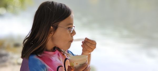 Close-up of young woman drinking glass