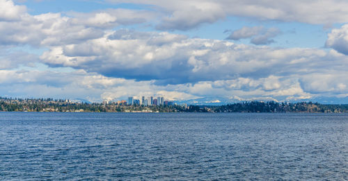 Modern buildings in bellevue, washington with the cascades range in the background.